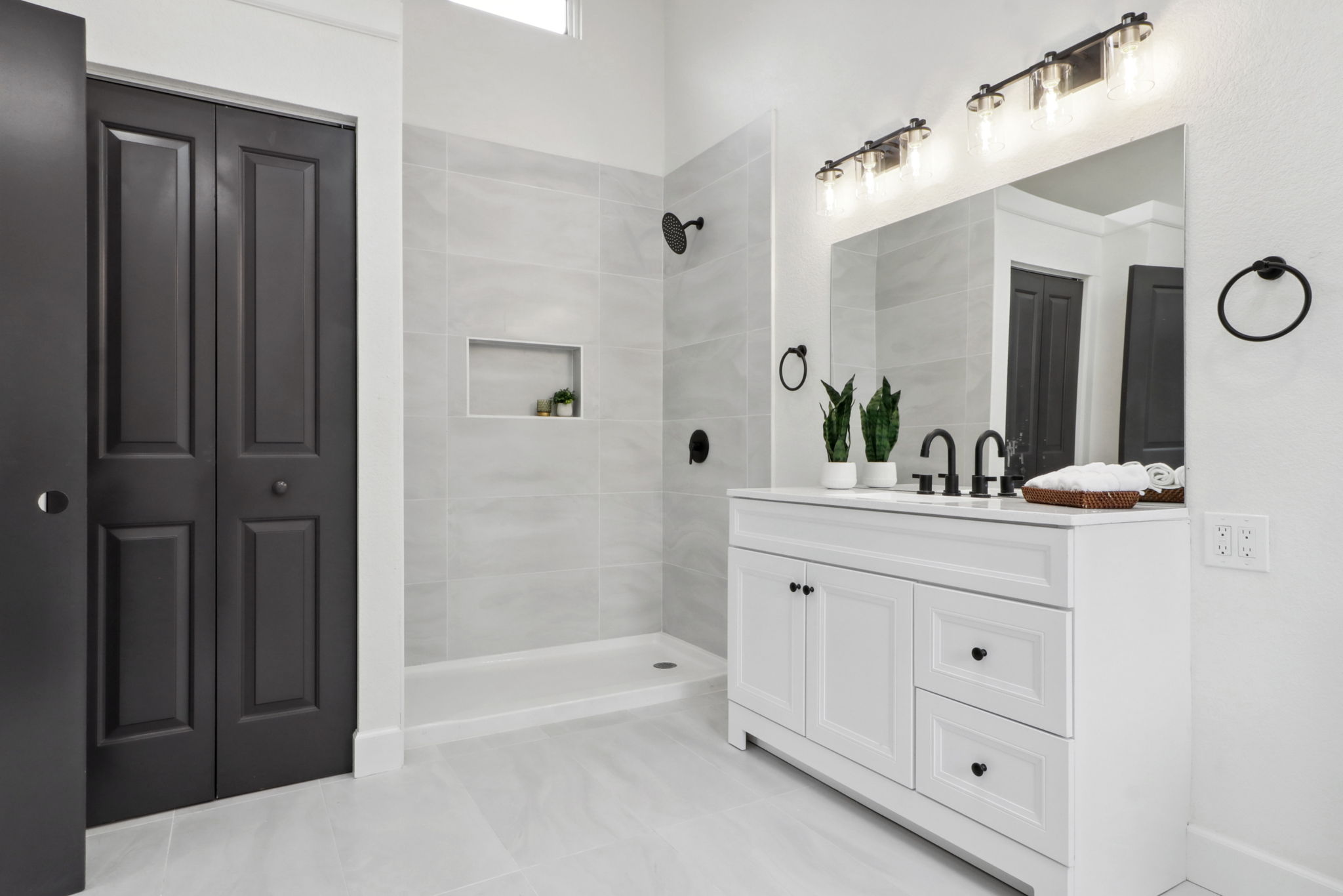Full bathroom remodel in Aurora with large format tile shower and matte black fixtures