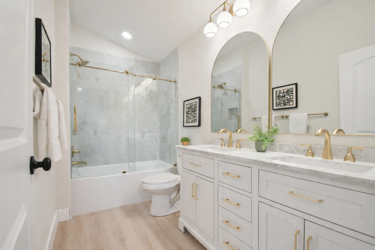 Full bathroom remodel in Highlands Ranch with double vanity, large format tile shower and glass enclosure